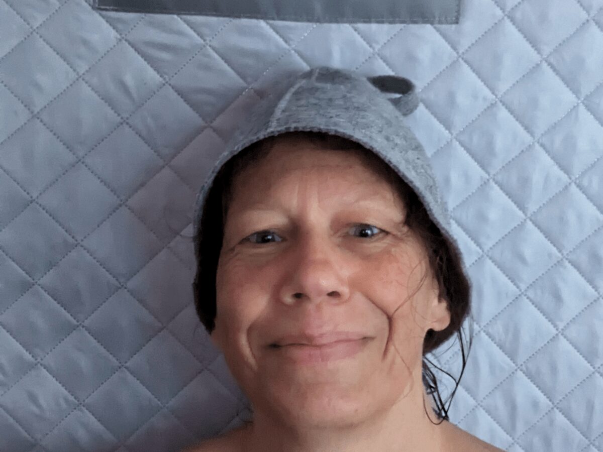 female face with felt hat